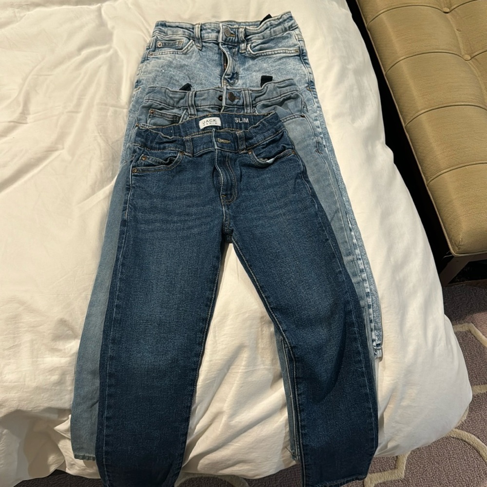 Four pairs of boys size 7 adjustable/stretch jeans.
